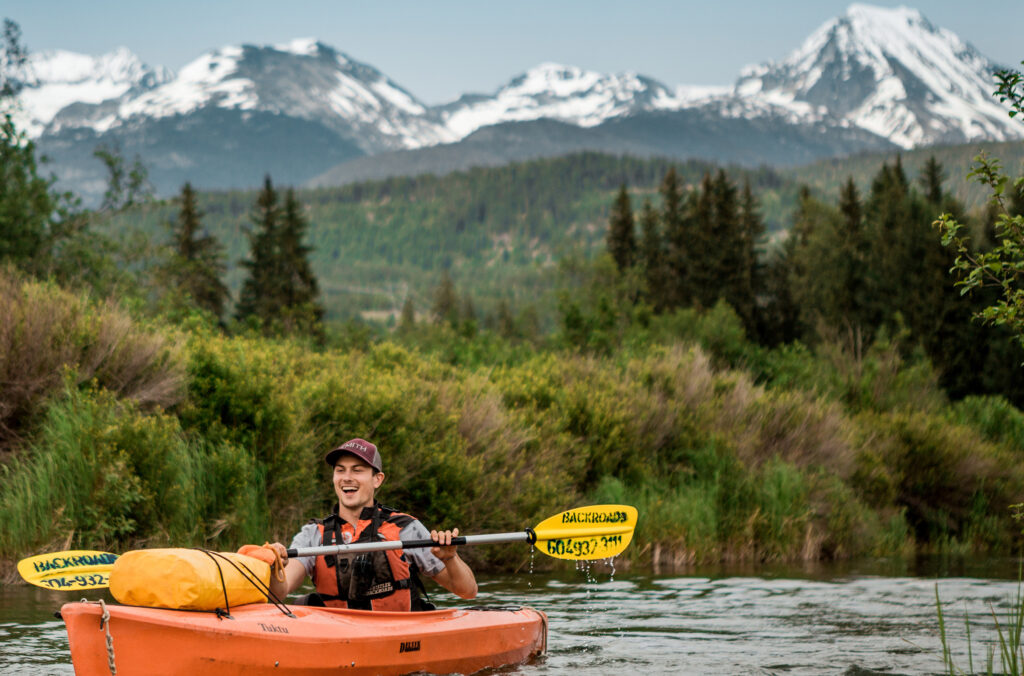 Spencer kayaking down the River of Golden Dreams.
