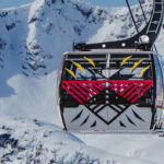 Chief Janice George and Buddy Joseph's artwork wrapped on a PEAK 2 PEAK Gondola, part of The Gondola Gallery by Epic.