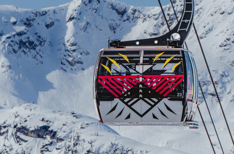 Chief Janice George and Buddy Joseph's artwork wrapped on a PEAK 2 PEAK Gondola, part of The Gondola Gallery by Epic.