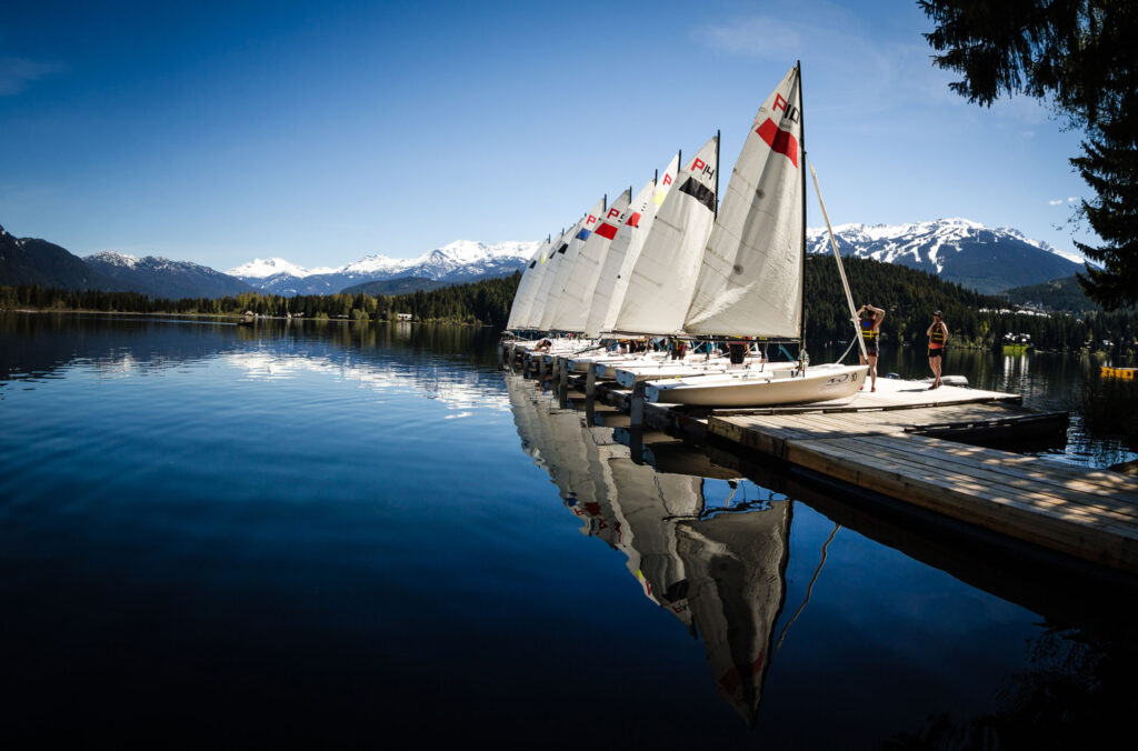 Sailboats up on a floating dock on the shores of Alta Lake in Whistler.