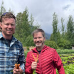 Eric Griffith from Alta Bistro and Mike Douglas stand in the lush fields of Root Down Farm in Pemberton.