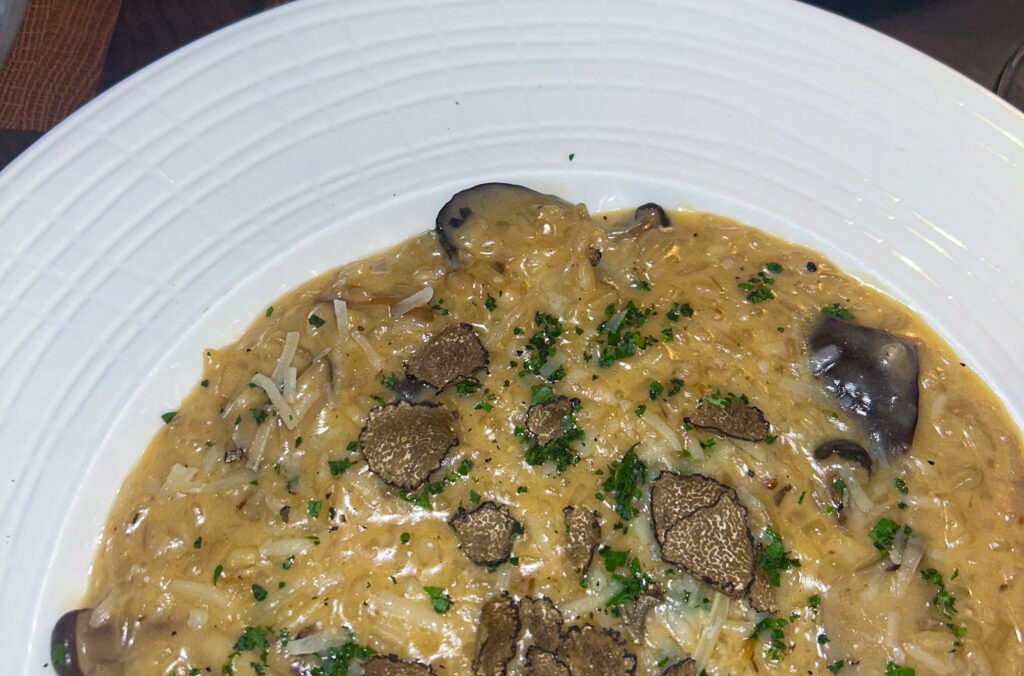 A close up of the mushroom risotto served at Sidecut, Four Seasons Whistler.