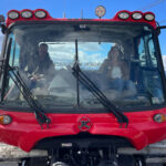 Host of the Whistler Changemaker Series, Mike Douglas and Alison Jenkins, Whistler Blackcomb's Sustainability Manager sit in a snowcat discussing Whistler Blackcomb's goal of hitting net zero by 2030.