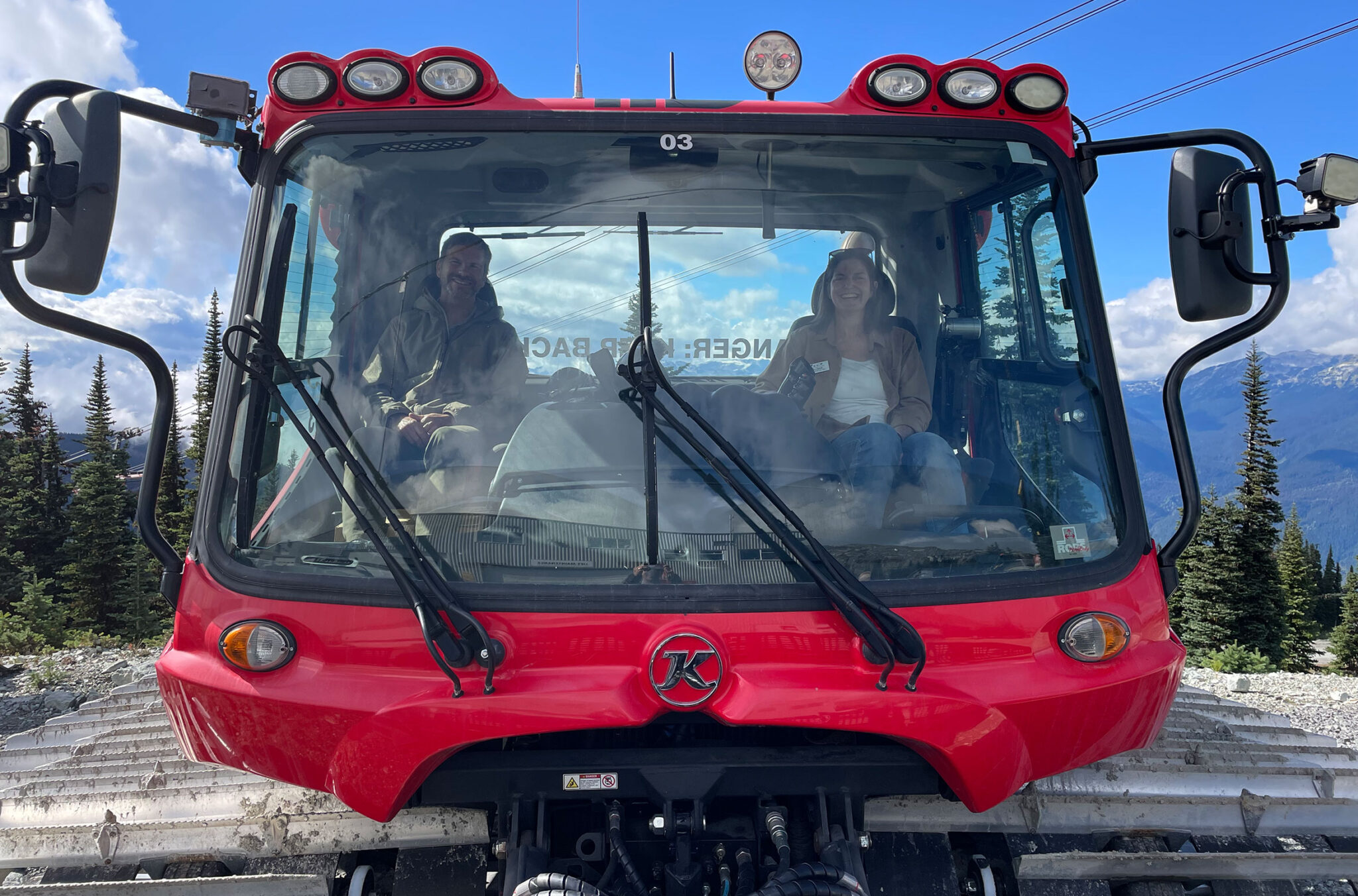 Host of the Whistler Changemaker Series, Mike Douglas and Alison Jenkins, Whistler Blackcomb's Sustainability Manager sit in a snowcat discussing Whistler Blackcomb's goal of hitting net zero by 2030.