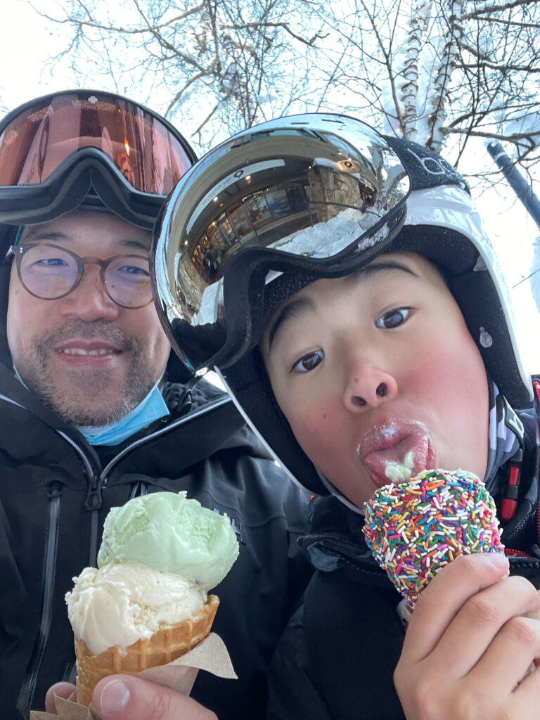 Kevin and Bear Yeung enjoy ice cream in Whistler after skiing.