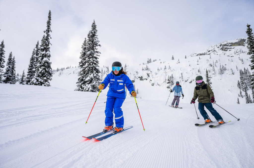 A ski instructor takes two teen skiers for a rip on the slopes of Whistler Blackcomb.