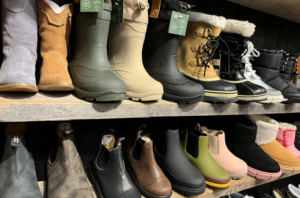 A row of winter boots good for exploring the village and valley at The Circle in Whistler.