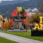 The yellow and black I AM emblem at the entrance to Whistler, signifying the Invictus Games Vancouver Whistler 2025.