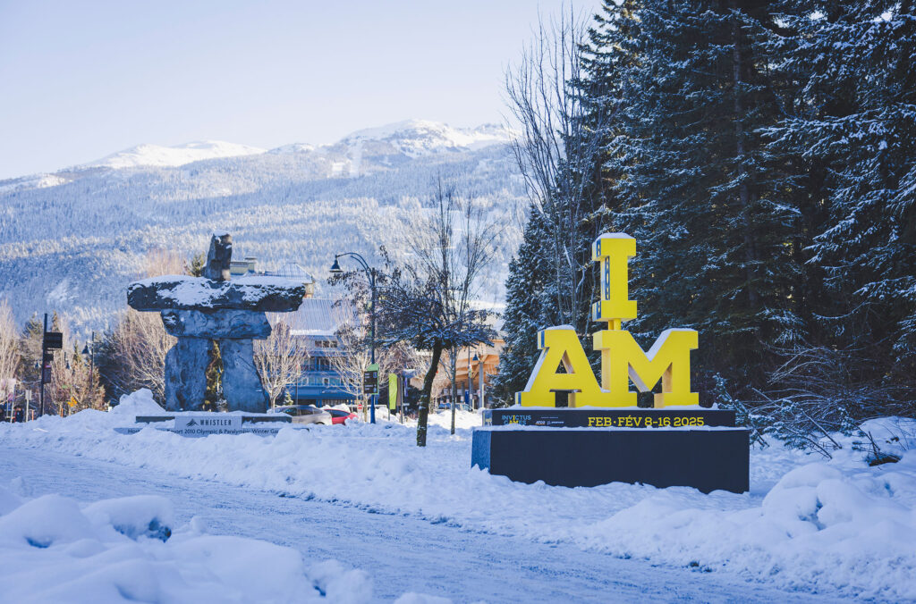 The yellow and black I AM emblem at the entrance to Whistler, signifying the Invictus Games Vancouver Whistler 2025.