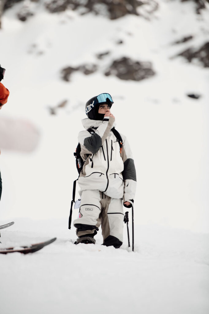 WeiTien looking up at the mountain, considering his line at the World Freeride Tour.