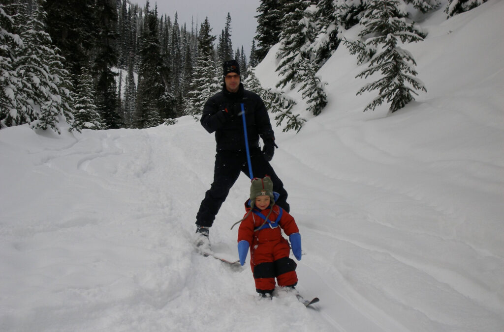 WeiTien skis as a toddler with his dad in Whistler.