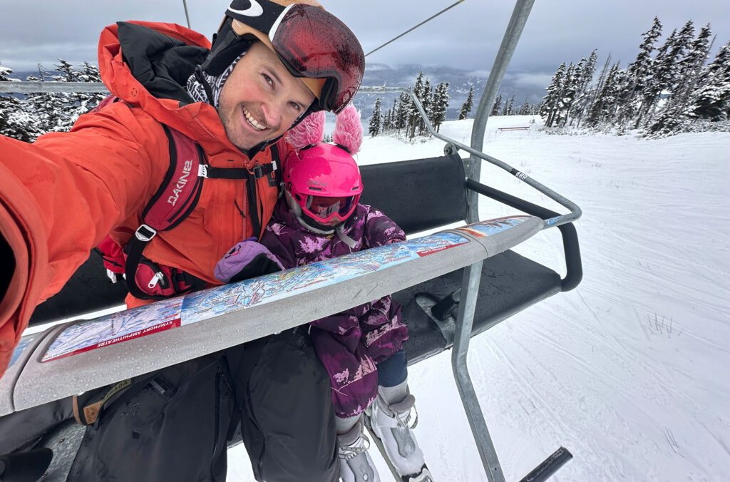 Rich sat on a chairlift with his daughter while skiing on Whistler Blackcomb.