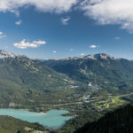 The Whistler Valley in the summertime. Snowcapped mountains, sparkling lakes and lush, green forests.