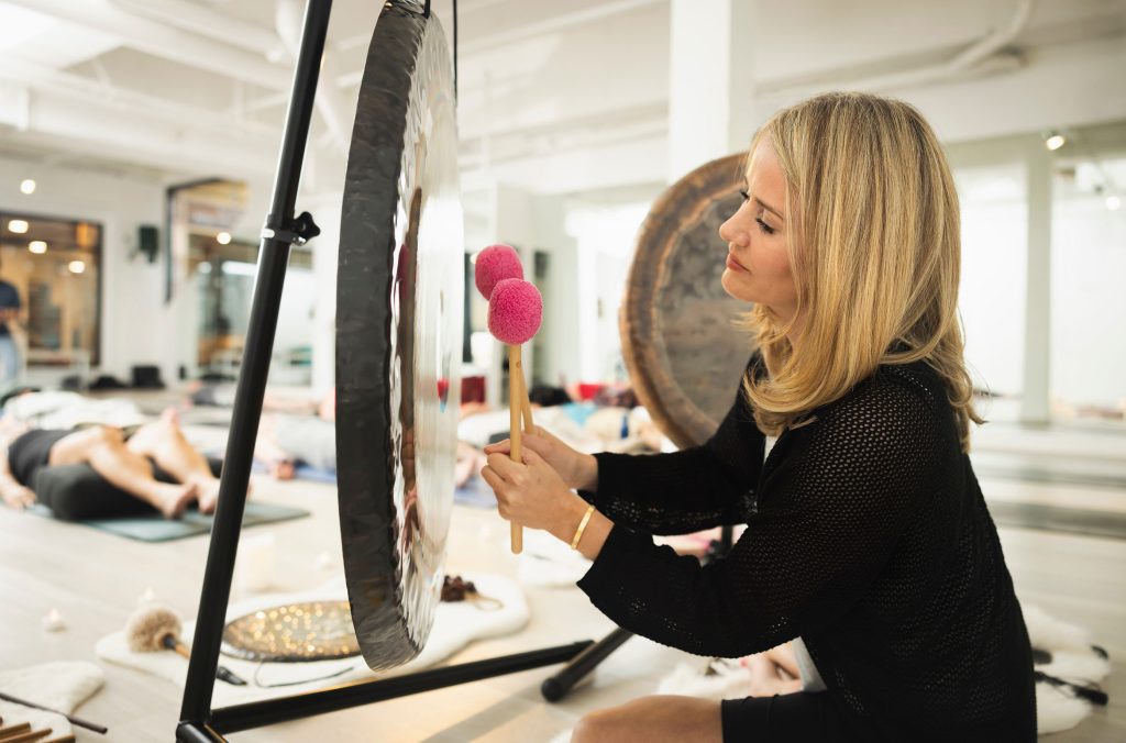 A practitioner takes Nourish guests through a sound bath experience in Whistler.