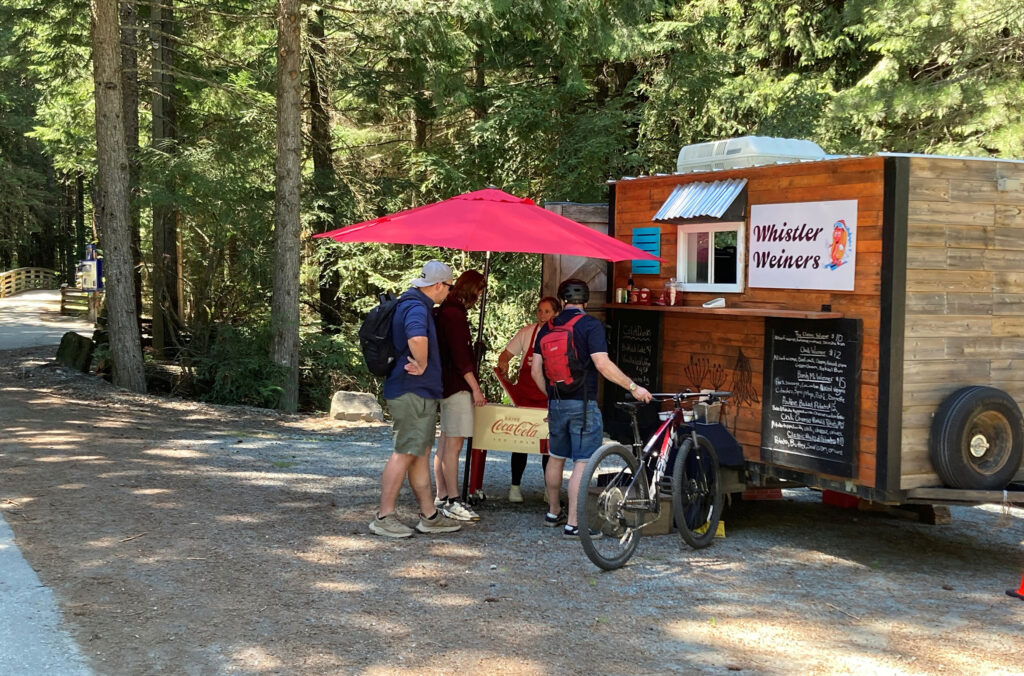 Park goers visit the Whistler Weiners food truck at Lost Lake.