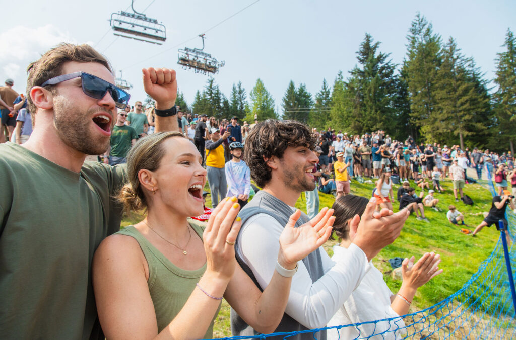 Three friends cheer on athletes at Crankworx Whistler.