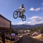 A bike athlete takes to the air while jumping off a feature at the Redbull Joyride event at Crankworx Whistler.