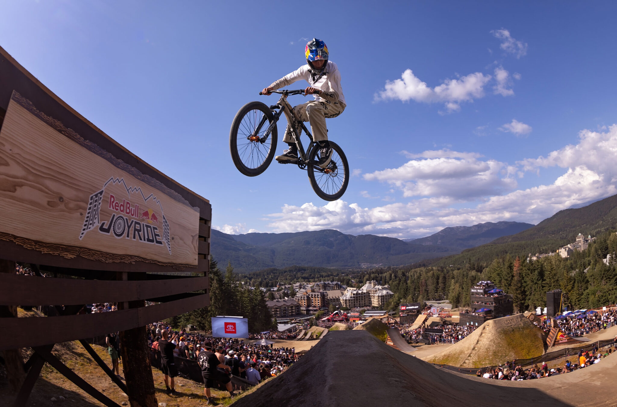 A bike athlete takes to the air while jumping off a feature at the Redbull Joyride event at Crankworx Whistler.