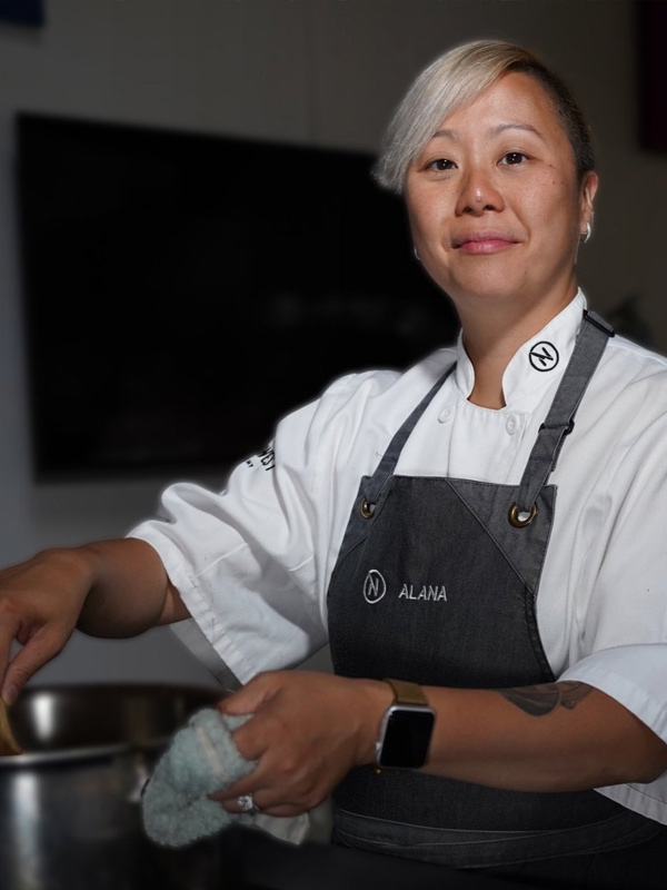 Chef Alana Maas stirs a bowl.