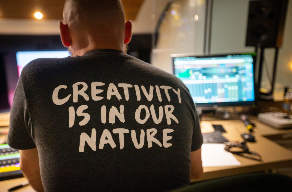 An Arts Whistler team member wears a t-shirt that says "creativity is in our nature".