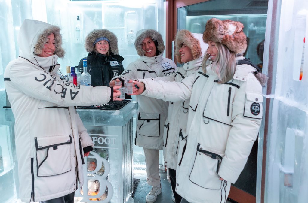 A group of people tasting vodka at the Bearfoot Bistro.