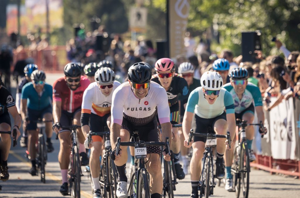 Racers cycle in the sunshine from Vancouver to Whistler in the GranFondo Whistler.