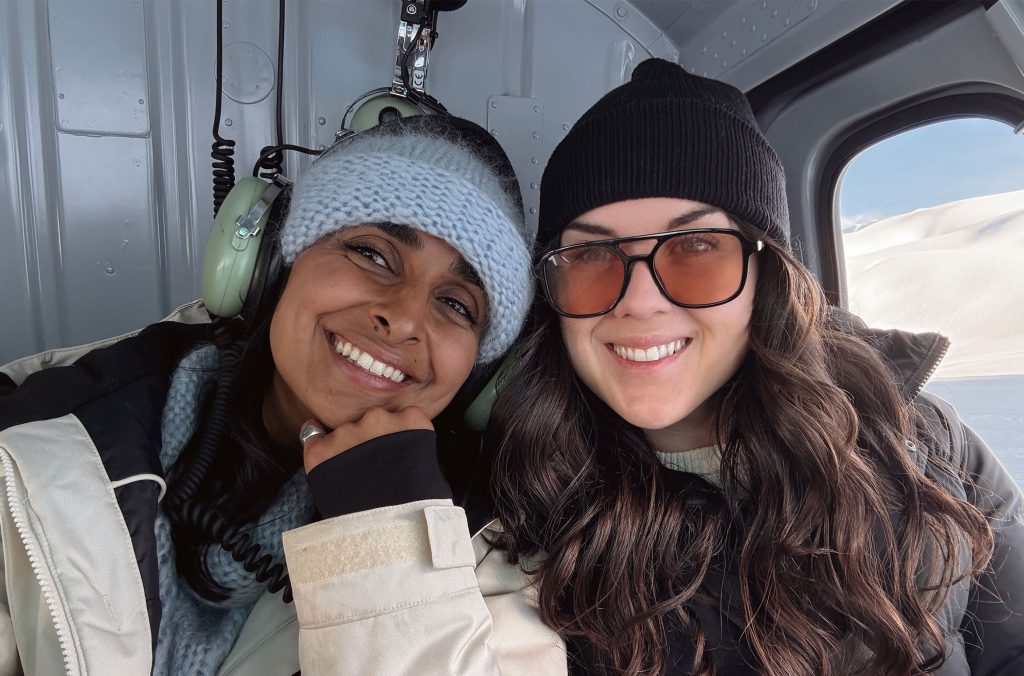 Morgan and her friend ride in the helicopter, excited for the ice caves ahead.