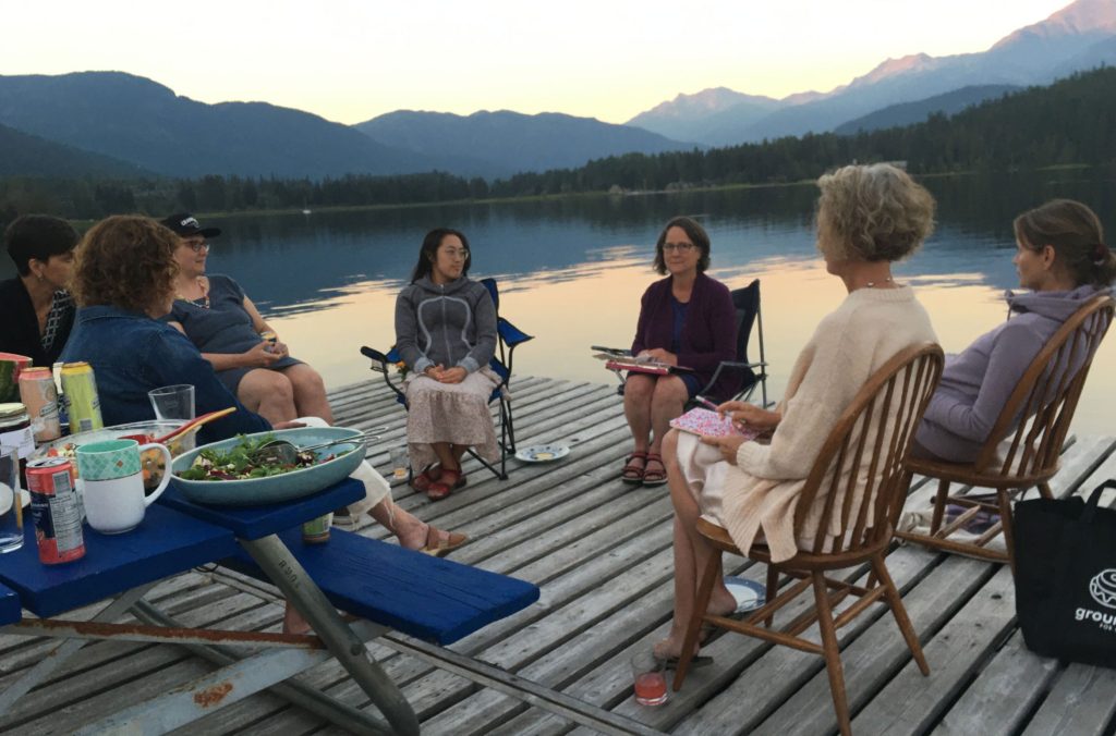 Writers meet on a floating dock on one of Whistler's lakes.