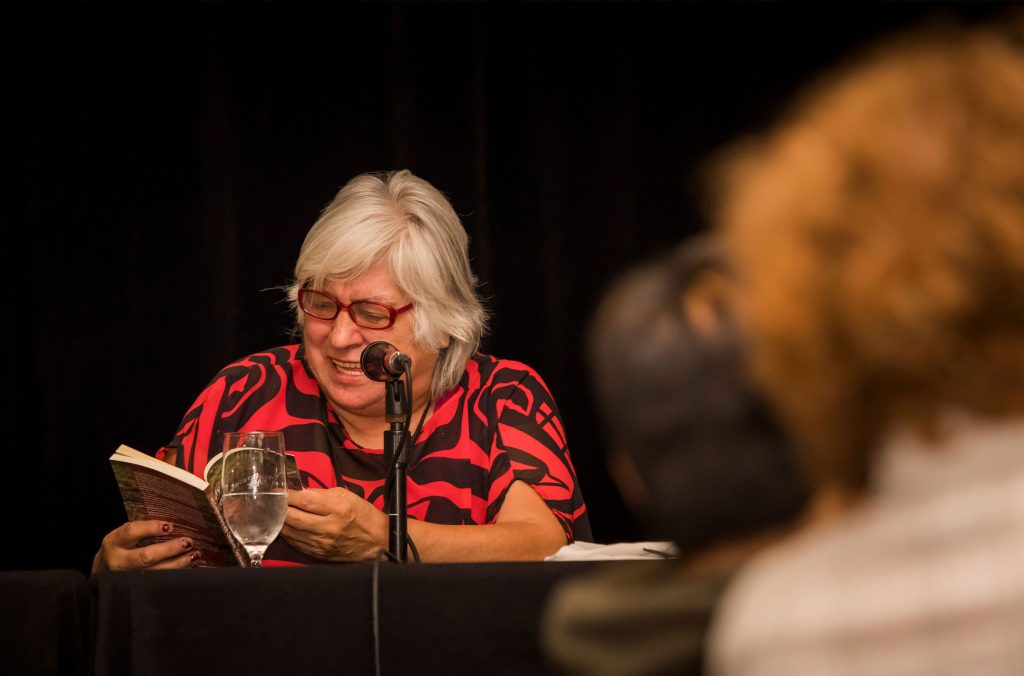 An author reads from their book at the Whistler Writers Festival. 