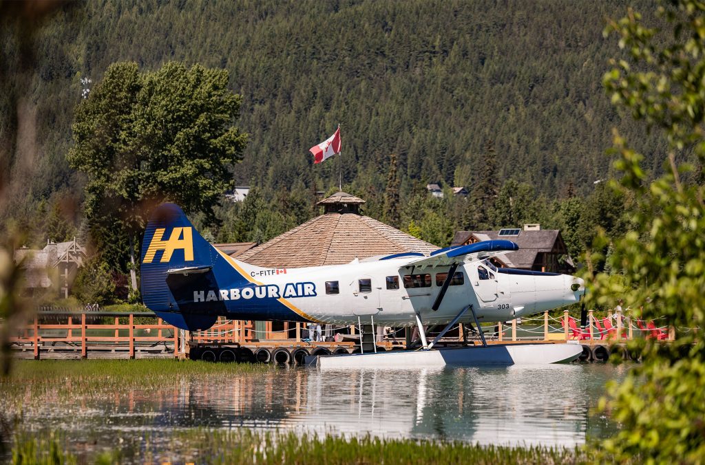 A Harbour Air Seaplane floats on Green Lake in Whistler.