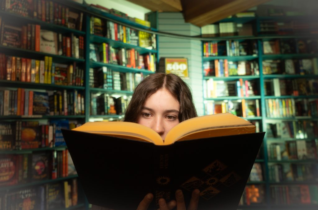 A person reads a book at Armchair Books in Whistler.