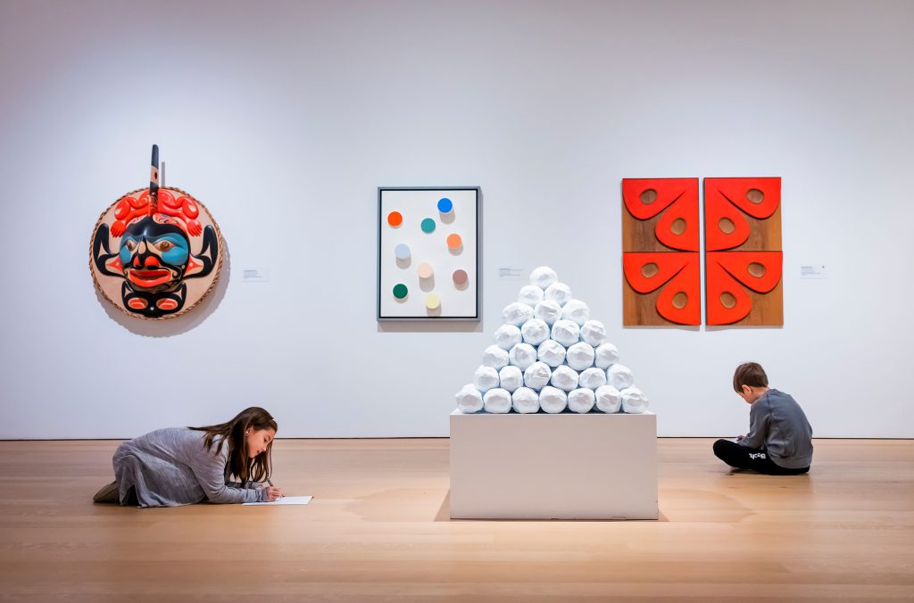 Two children draw on sketch pads at the Audain Art Museum in Whistler.