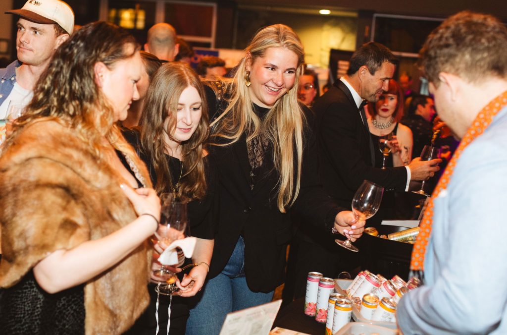 People gather around a table at the Straight Up event during Whistler Cornucopia.