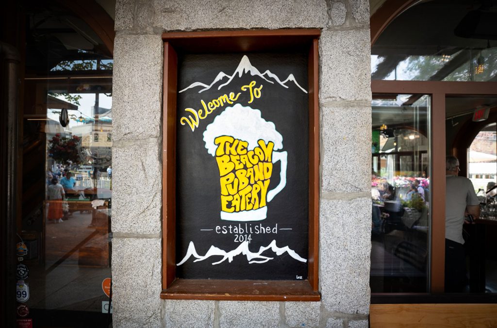 A fun beer-themed poster outside of The Beacon Pub in Whistler.
