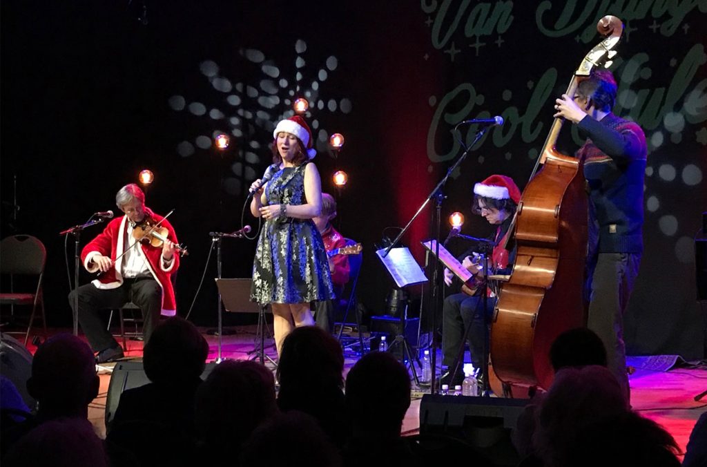 Cool Yule performs their gypsy jazz on stage in Whistler.