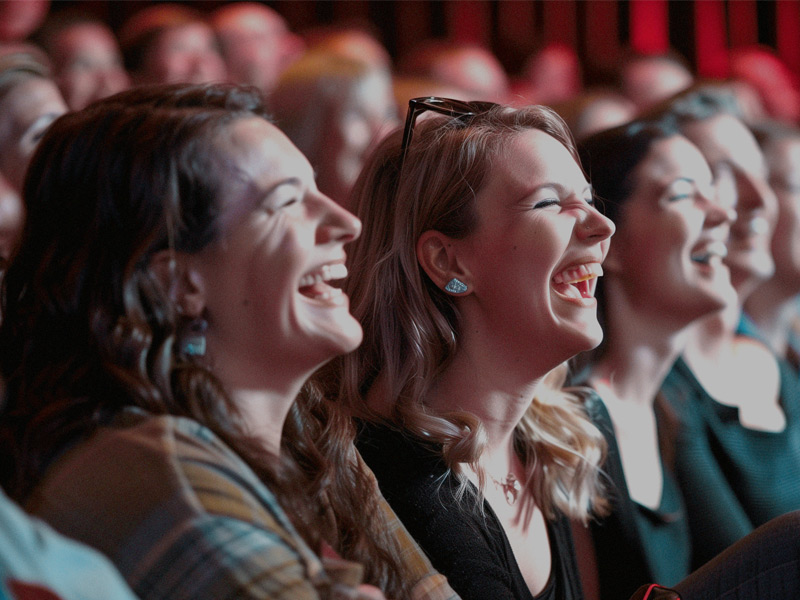 Audience members laugh during a Comedy Kitchen performance at Cornucopia in Whistler.