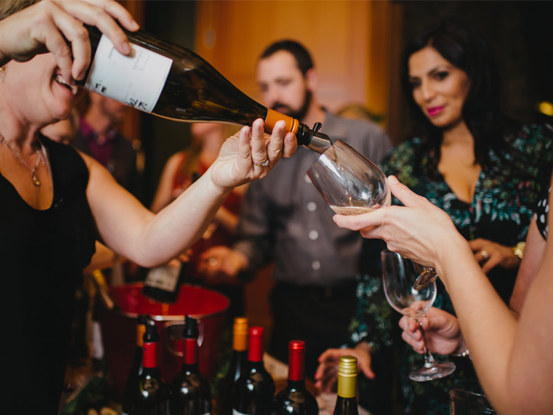 Wine poured into a guest’s glass during the CRUSH wine tasting at Cornucopia in Whistler.