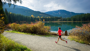 Whistler Marathon runner racing by Lost Lake