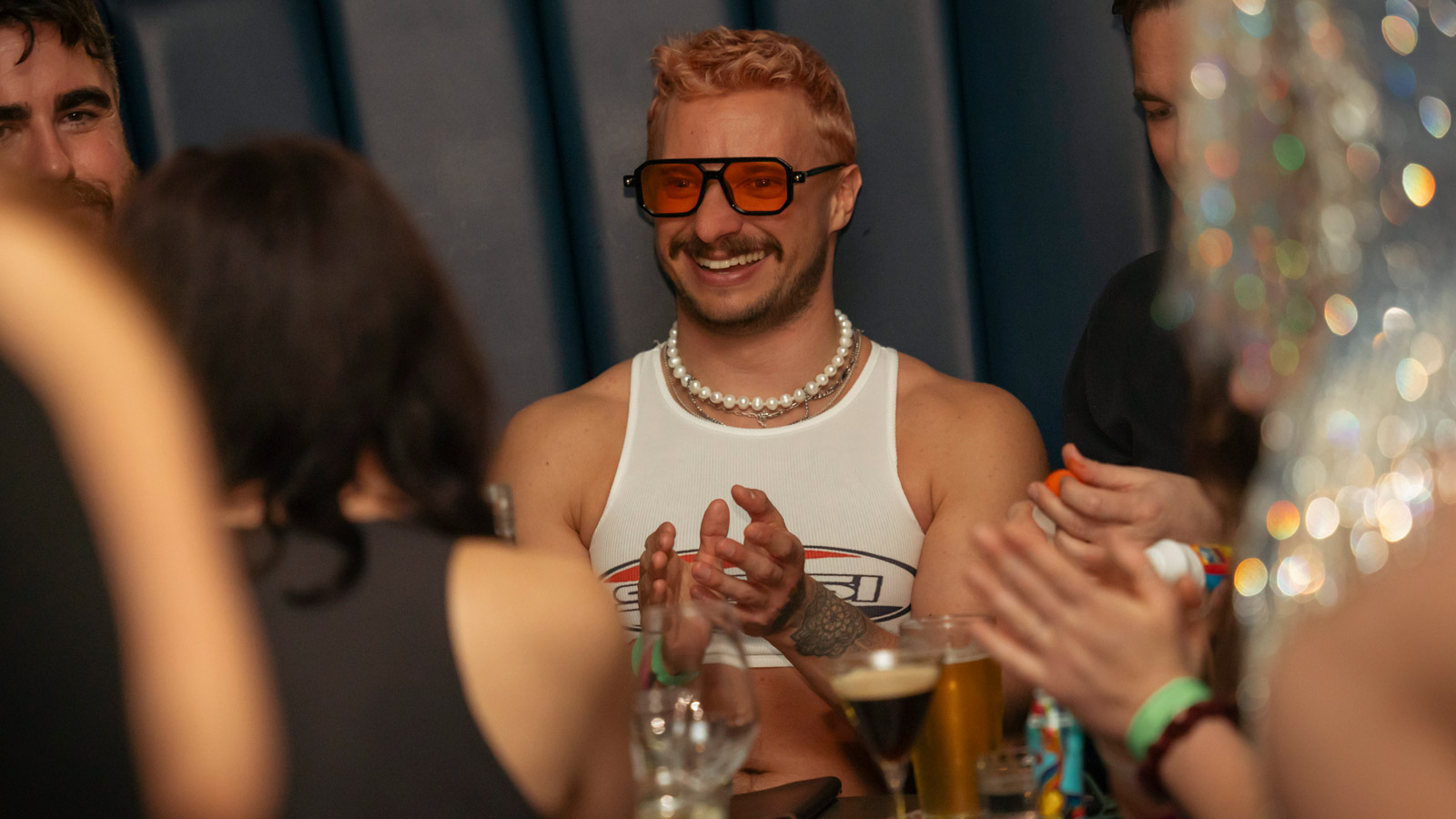 Guests celebrating together over drinks during Whistler Pride Festival.