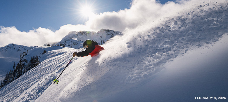 A skier in the high alpine on Whistler Mountain, with Whistler Peak in the background, enjoying great snow conditions on February 8, 2026