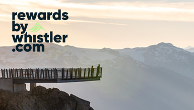 Mountain bikers descend a rugged alpine trail on Whistler Mountain at golden hour, with gondola cabins suspended above forested slopes and the rewardsbywhistler.com logo in the corner, capturing the thrill of Whistler’s world-class mountain biking..