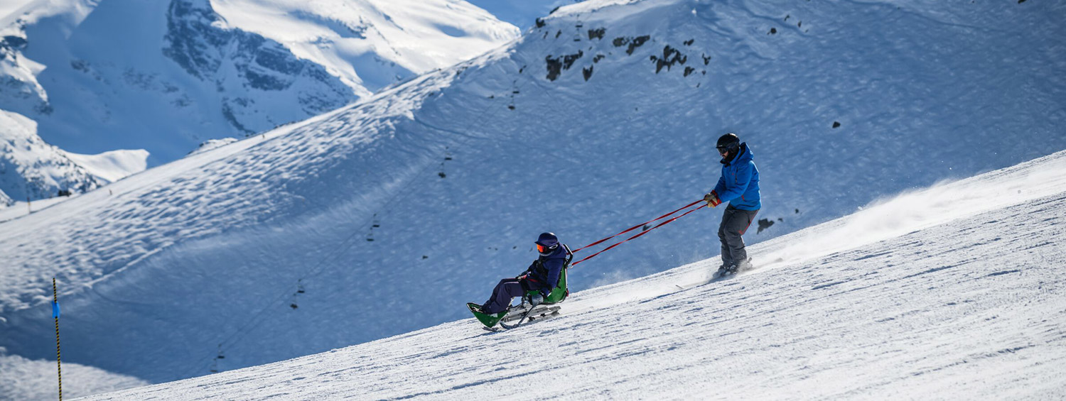 Adaptive skier on an alpine groomer on Whistler Mountain