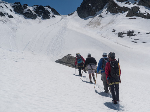 Guests walking across snow and ice on a guided Whistler Mountain glacier tour.