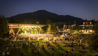 A large gathering of people at Whistler Olympic Plaza for the Summer Concert Series