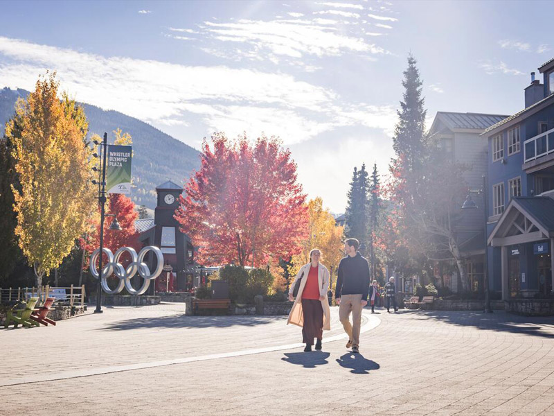 Couple exploring the Village in Whistler, British Columbia.