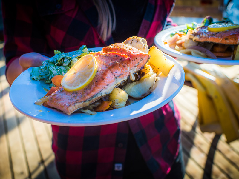 Salmon Bake by 4x4 tour in Whistler BC, featuring a West Coast salmon dinner served at Crystal Hut after a scenic Blackcomb Mountain off-road adventure.