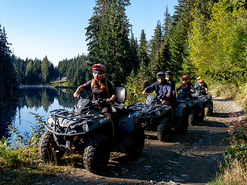 Guests arrive at a secluded alpine lake during the Backcountry Lake & Lunch by ATV tour in Whistler.