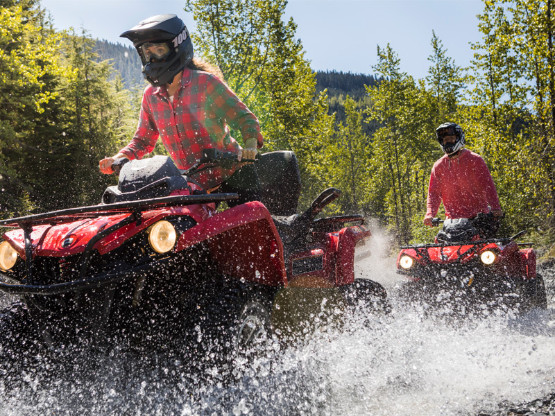 An ATV rider navigates rugged mountain terrain and forest trails during the Wild Wild West ATV Tour in Whistler.