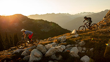 People biking in the mountains of Whistler British Columbia