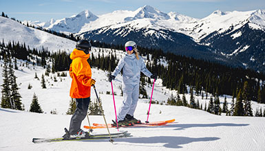 Skiers enjoying the sun on the slopes of Whistler Blackcomb